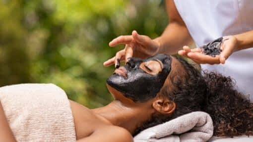 woman with face mask from activated charcoal hacks 